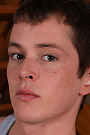 Cute twink Alex strokes his cock in a flipped over chair.